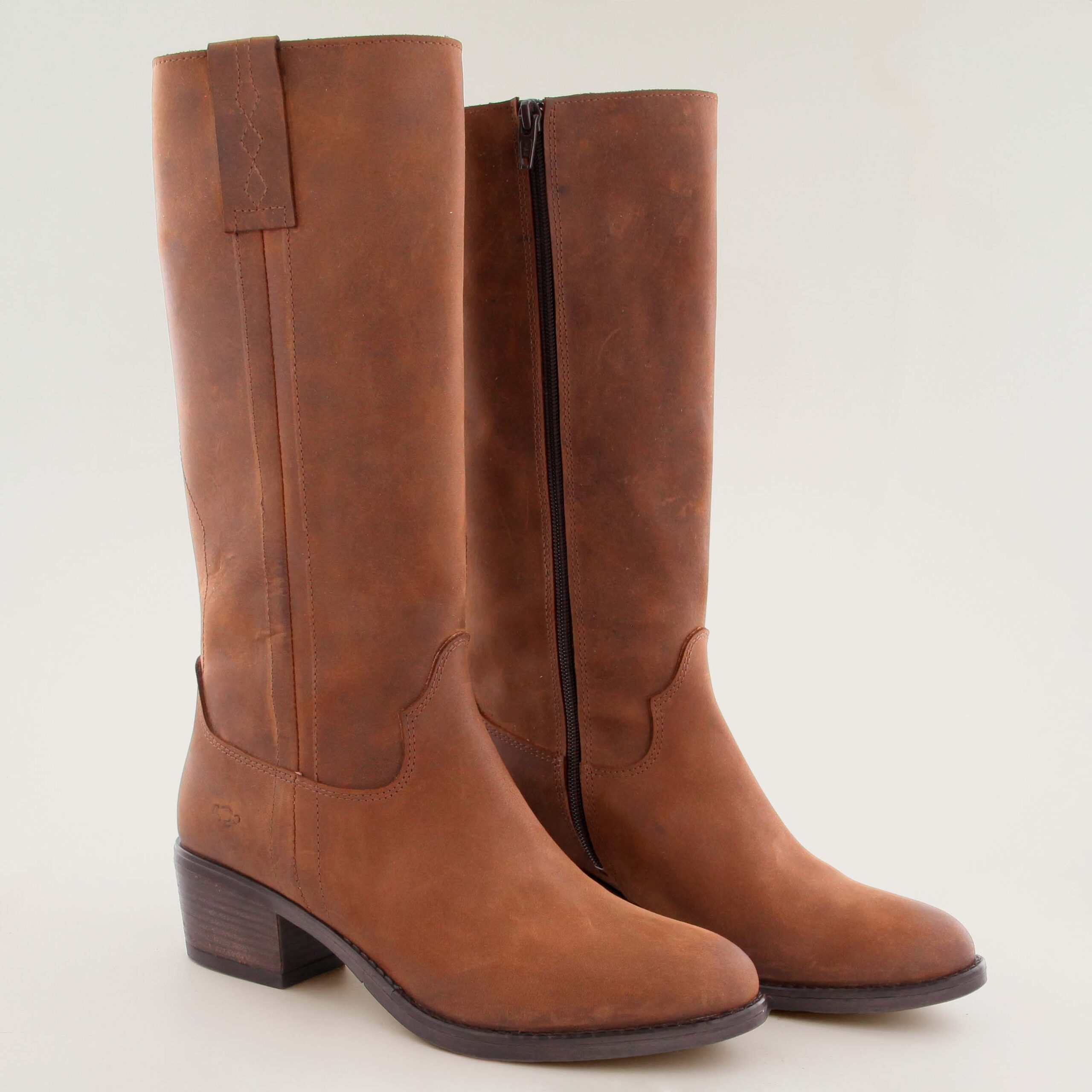 Brown leather knee-high boot, in an equestrian or cowboy style, featuring a stacked block heel.