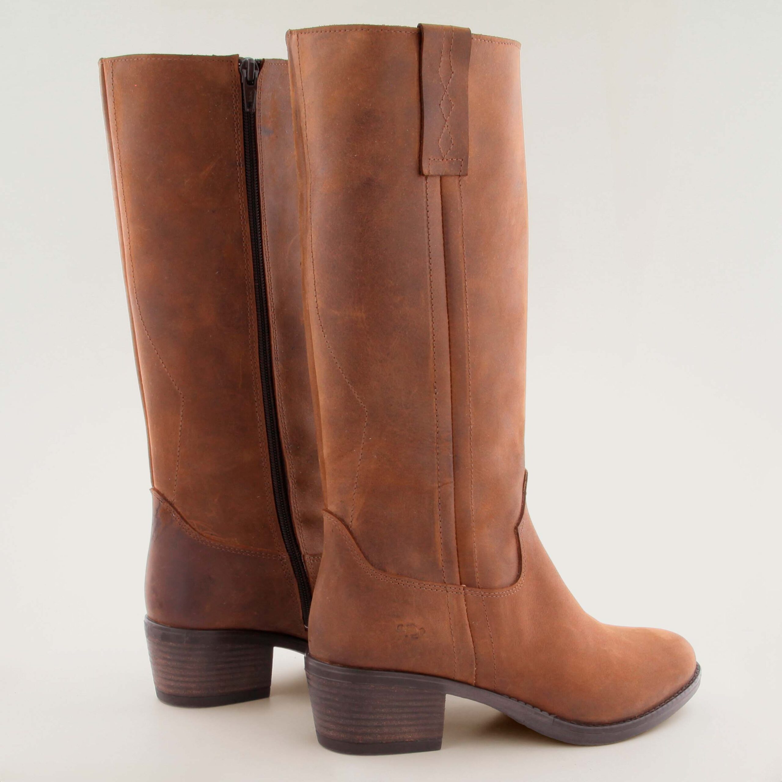 Brown leather knee-high boot, in an equestrian or cowboy style, featuring a stacked block heel.