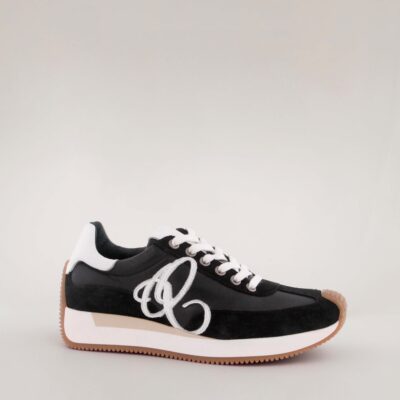 Stela AQAshoes women's sneaker in black leather with white details and a beige/caramel outsole.